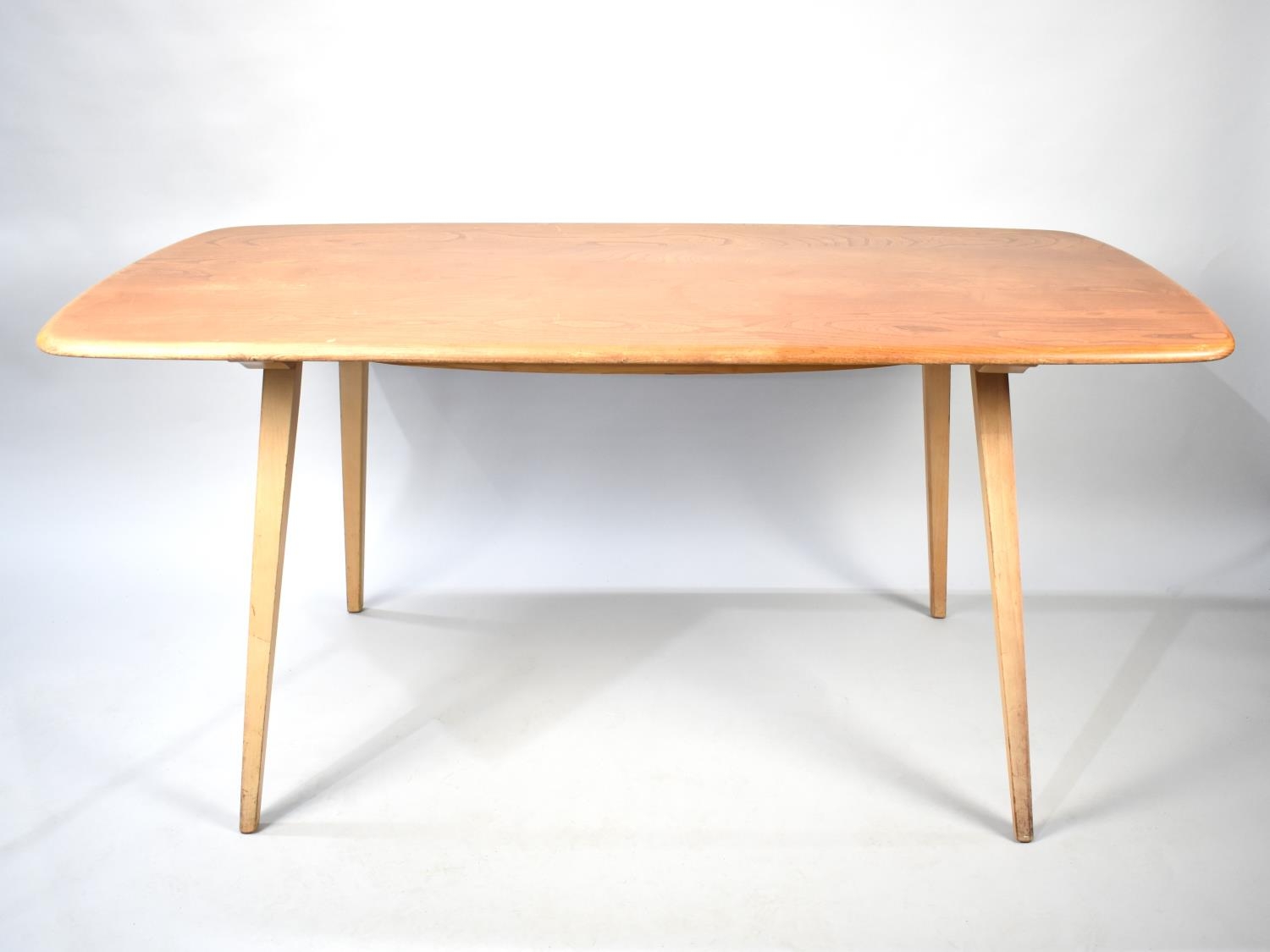 An Ercol Rectangular Dining Table, 150x74cms