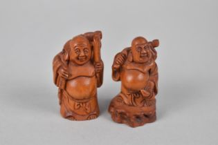 Two Carved Wooden Netsukes Modelled as Buddha