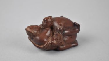 A Modern Carved Wooden Erotic Netsuke in the Form of Couple "In Flagrante", Signed to Base