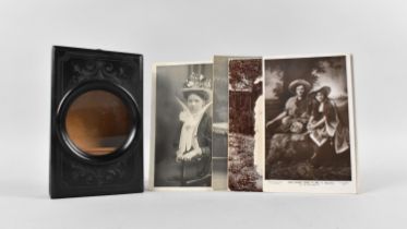 A Late Victorian Carved And Ebonized Magnifier Card Viewer with Collection of Monochrome Postcards