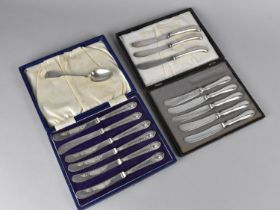 A Cased Set of Six Silver Handled Butter Knives Together with a Cased Set of Five Similar