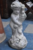 A Reconstituted Figural Water Feature in the Form of Cherub Holding Seahorse, 40cms High