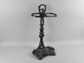 A Reproduction Green Painted Cast Metal Two Section Stick Stand in the Coalbrookdale Style, 30cms