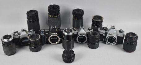 A Collection of Four 35mm Camera Bodies and Various Telescopic and Other Lenses