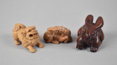 Three Various Netsukes to Include Carved Wooden Hare, Temple Lion and a Horse