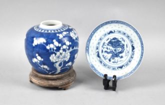 A Chinese Porcelain Blue and White Prunus Pattern Ginger Jar (13cm high) on Wooden Stand Together