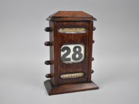 An Edwardian Oak Desktop Perpetual Calendar with Day, Date and Month, 22cms High