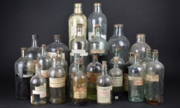 A Collection of Twenty-three Various Glass Chemist or Apothecary Bottles, Some with Paper Labels,