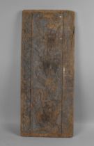 An Early Weathered Carved Panel depicting in Relief Thistles, Scrolls, 72x30cms