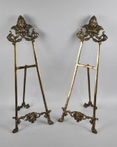 A Pair of Large French Style Brass Easel Stands with Mask Decoration, 60cms High