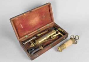 A 19th Century Mahogany Cased Syringe by W Mathews of London (Box with some condition issues)