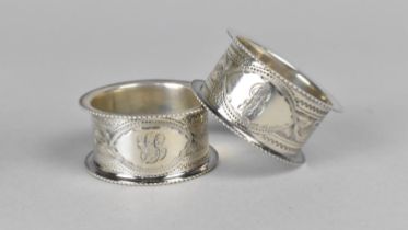 A Cased Pair of Edwardian Silver Napkin Rings, Birmingham Hallmark 1907 both with Chased Floral