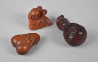 A Collection of Three Modern Wooden Netsukes, Erotic Example Carved with Face, Seated Monk with