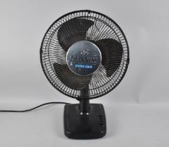 A Guinness "Extra Cold" Fan with Illuminating Guard