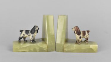 A Pair of Onyx Bookends Mounted with Cold Painted Spaniel Figures, 9.5cms High