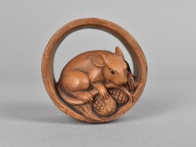 A Carved Wooden Netsuke in the Form of Mouse with Corn in Barrel