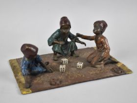 A Reproduction Cold Painted Bronze Figure Group in the Form of Arabic Children on Rug Playing