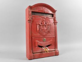 A Red Painted Cast Metal Wall Hanging Post Box, 39cms High, With Keys