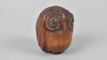 A Carved Wooden Netsuke in the Form of an Owl