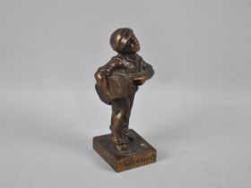 A Bronze Effect Brass Figure of a Paperboy 'Speshul', 17cms High