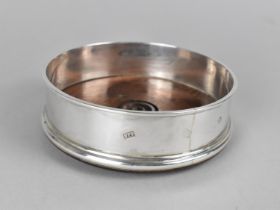 A Silver Mounted Bottle Coaster by W.E.V, London Hallmark 1983, 12.5cm diameter