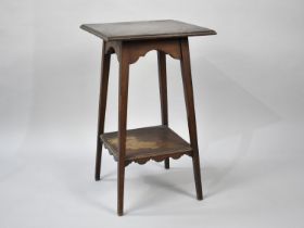 An Edwardian Mahogany two Tier Square Topped Occasional Table with Tapering Square Splayed Supports,