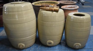 A Collection of Three Salt Glazed Ceramic Barrels with Wooden Taps