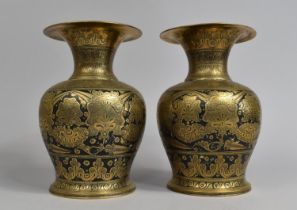 A Pair of Niello Brass Vases with Islamic Decoration, 20cms High