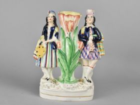 A 19th Century Staffordshire Flatback Spill Modelled with Highlander Couple, 22cm high