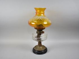 A Late Victorian Oil Lamp with Brass Support, Glass Reservoir and Later Coloured Glass Shade,