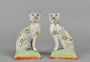 A Pair of Porcelain Studies of Cats, Modelled Seated on Cushion, 10cm high