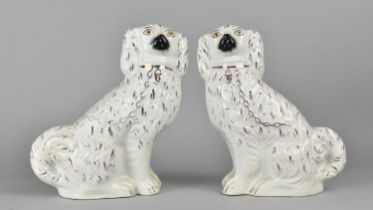 A Late 19th Century Pair of Staffordshire Spaniels, 23cm high