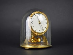 A 1950s Kundo Pillar Clock under Glass Dome with Instructions and Key, 15cms High