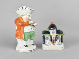 A 19th Century Staffordshire Flatback Modelled as a House Together with a Staffordshire Toby Jug,