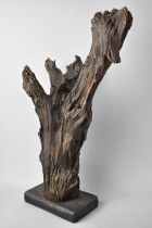 A Section of Petrified Timber or Driftwood on Wooden Plinth, 45cms High