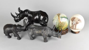 Two Rhino Ornaments Together with an Elephant and Two Painted Ostrich Eggs