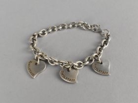 A Silver Tiffany & Co. Bracelet with Three Love Hearts