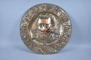 A Large Wall Hanging Circular Charger, Formerly Silver Plate on Copper, Decorated in Relief to
