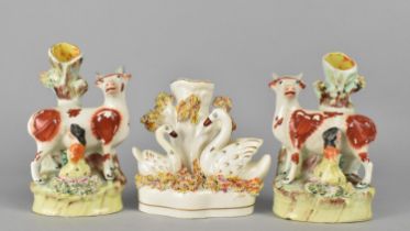 A Pair of Staffordshire Spill Vases Modelled with Milkmaid and Cow Together with a Further Example