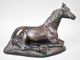 A Priory Castings Bronze Effect Resin Study of Reclining Horse, 26cms Long