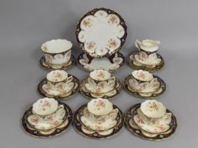 An Edwardian Tea Set decorated with Rose Motif, with Cobalt Blue and Gilt Enriched Trim to