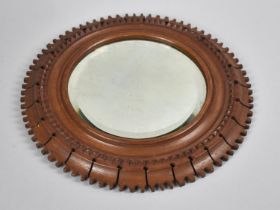 An Edwardian Carved and Pierced Circular Framed Wall Mirror with Bevelled Glass, 31.5cms Diameter