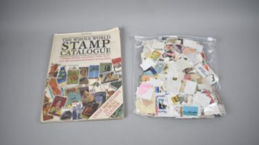 A Bag Containing Various British and Foreign Stamps together with a Stamp Catalogue