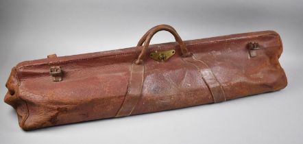 An Edwardian Leather Cricket Bag Containing Three Bats and Two Stumps