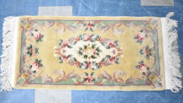 A Modern Chinese Woollen Hearth Rug on Faun Ground, 130x62cm