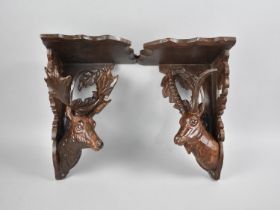 Two Black Forest Style Carved Wooden Corner Shelf Sconces with Stag and Alpine Ibex Supports,