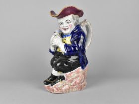 A Staffordshire Toby Jug, 24cm high