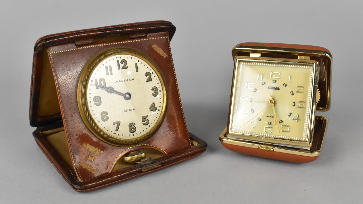 An Edwardian Leather Cased Travelling Alarm Clock by Waltham, Movement requires Attention together