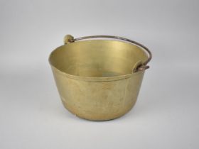 A Vintage Brass Jam Kettle with iron Loop Handle, 30cms Diameter