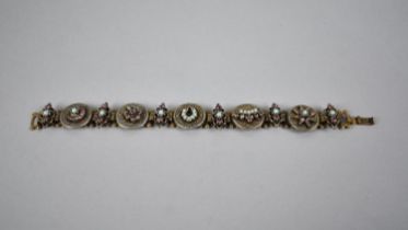A Vintage Charm Bracelet, Unmarked Metal with Jewelled Circular Panels Depicting Stars, Crowns,